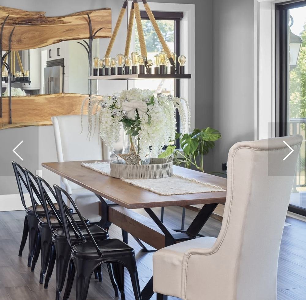 Dining area with live-edge table and open view toward a bright kitchen